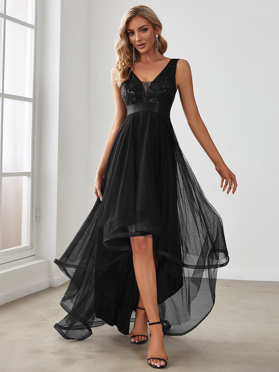 Black high-low tulle prom dress with deep V-neck and sequin appliques.