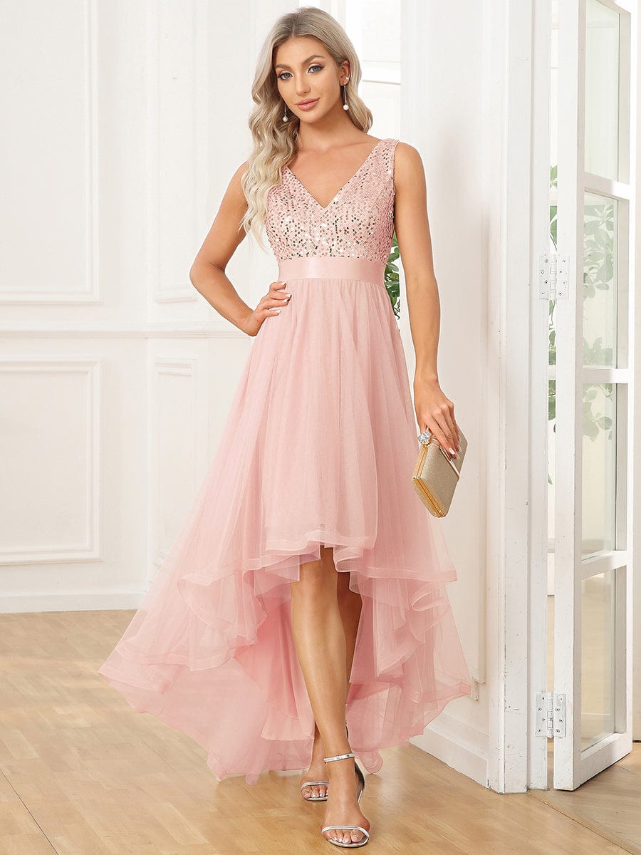 Front view of a woman in a pink sequin bodice high-low dress.