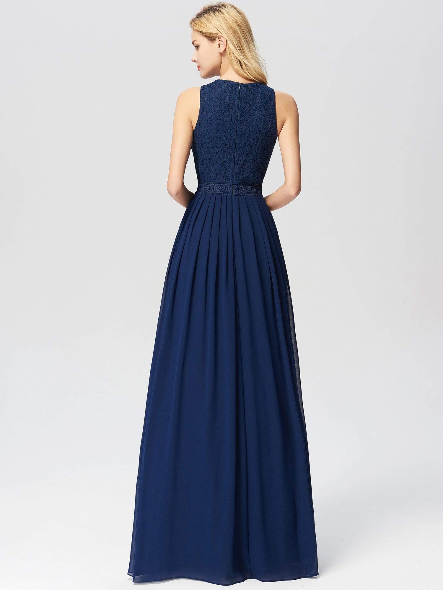 Close-up of the lace bodice and flowing skirt of the light blue bridesmaid dress.