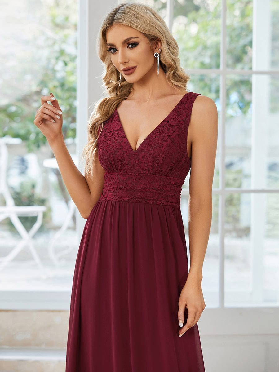Full length view of a red lace and chiffon long evening dress.
