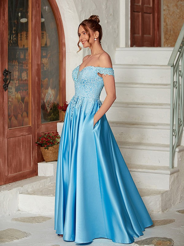 Side view of elegant light blue A-line prom dress.