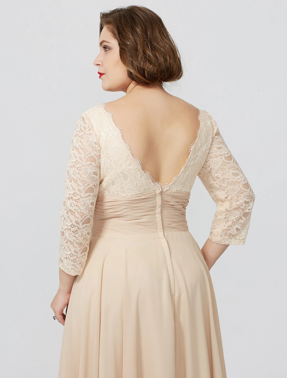 Detail of the chiffon lace fabric and sash on the formal gown.
