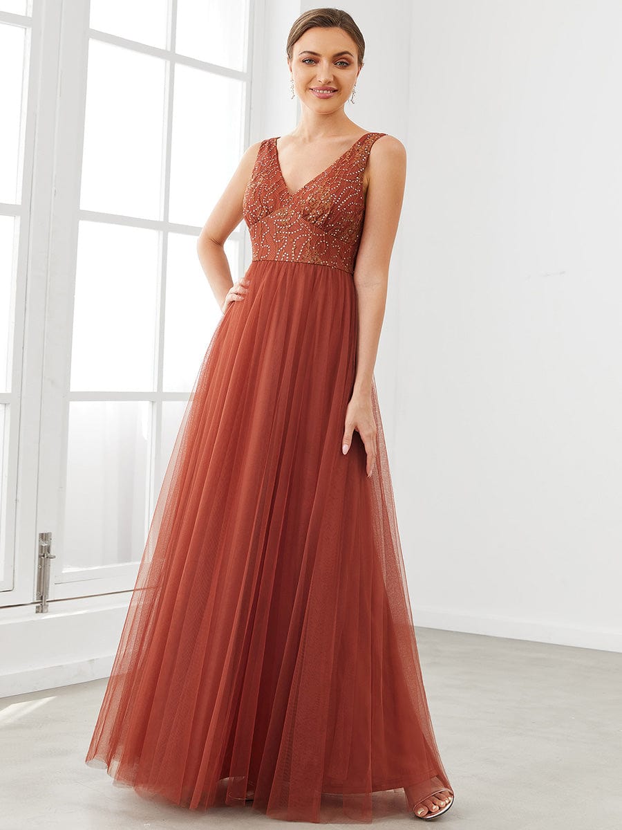 Model wearing a long, elegant A-line V-neck tulle bridesmaid dress.