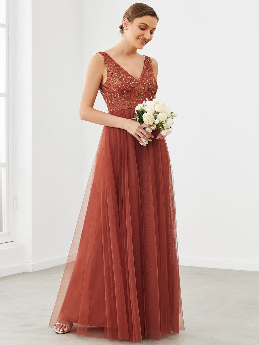 Model posing in the sleeveless A-line tulle bridesmaid dress, highlighting the fabric.