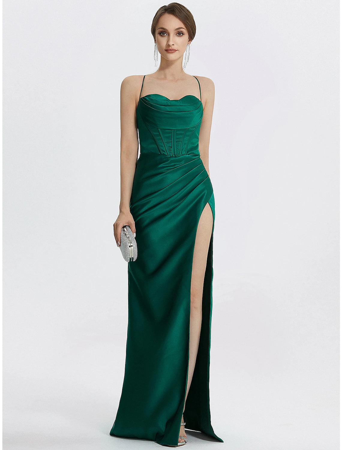 Side profile of a black satin mermaid dress, highlighting the leg slit.