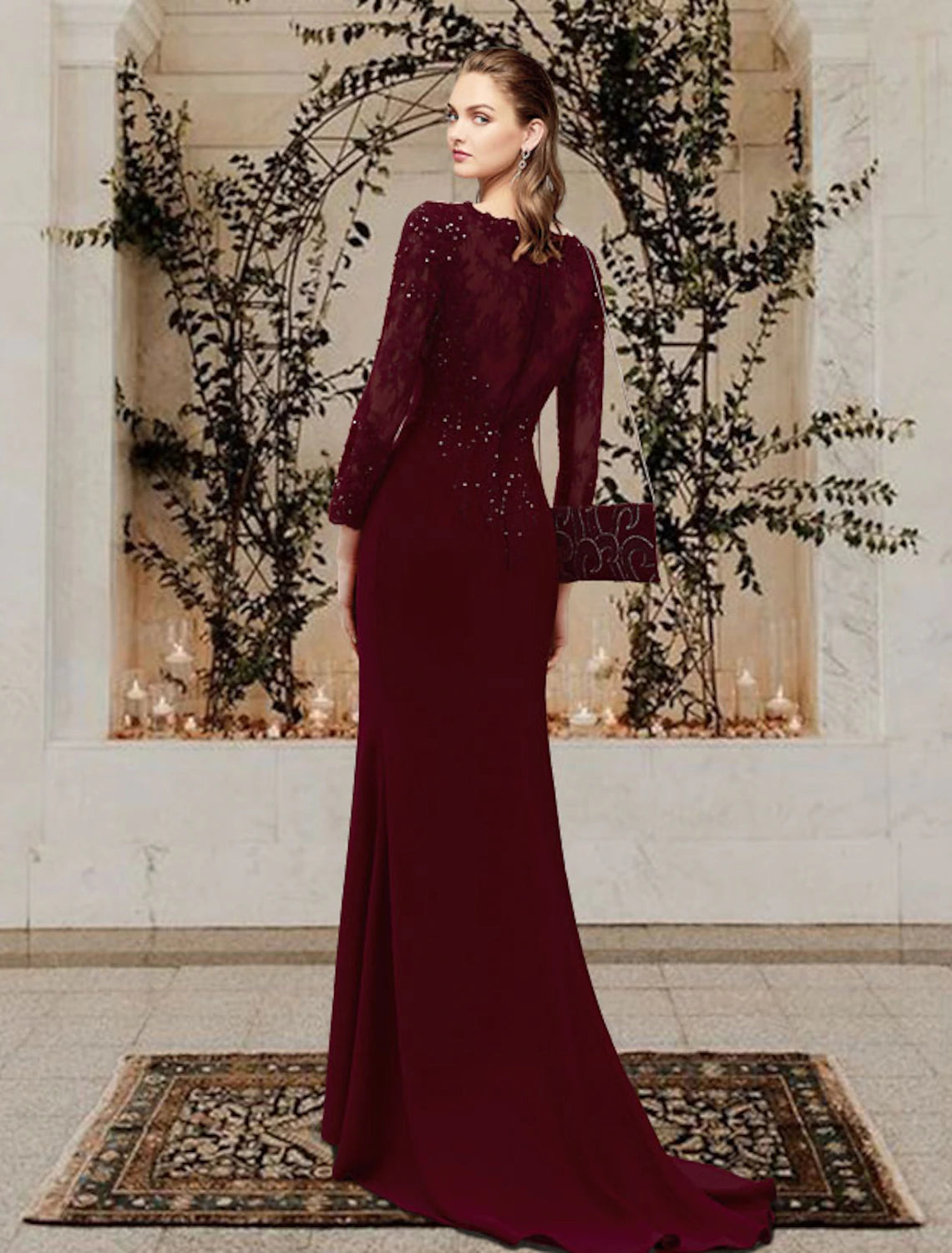 Back view of the mermaid mother of the bride gown, showcasing the sweep train and delicate appliques.