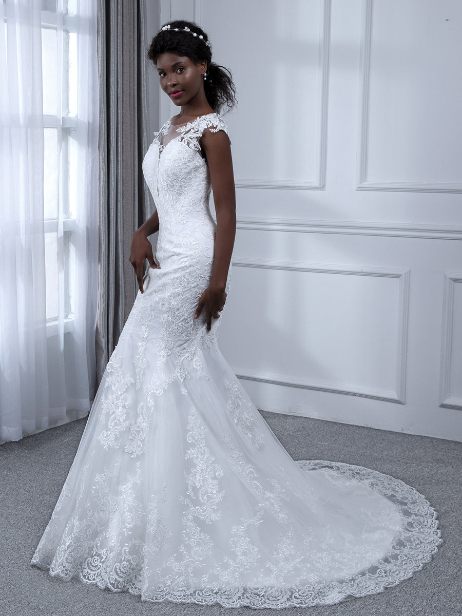 Weitese mermaid wedding dress with sheer neck and appliques, front view.