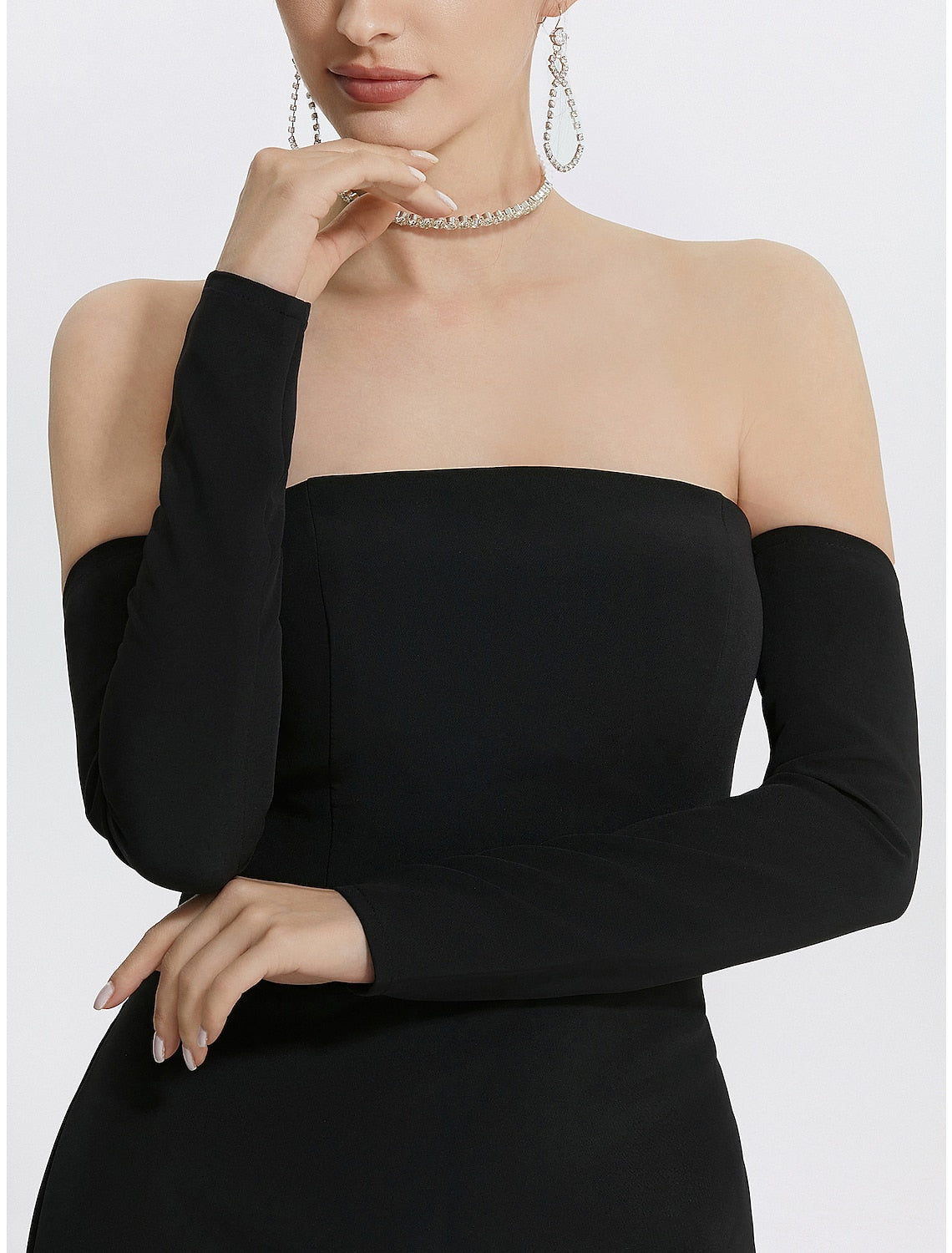 Back view of a black strapless mermaid evening dress.