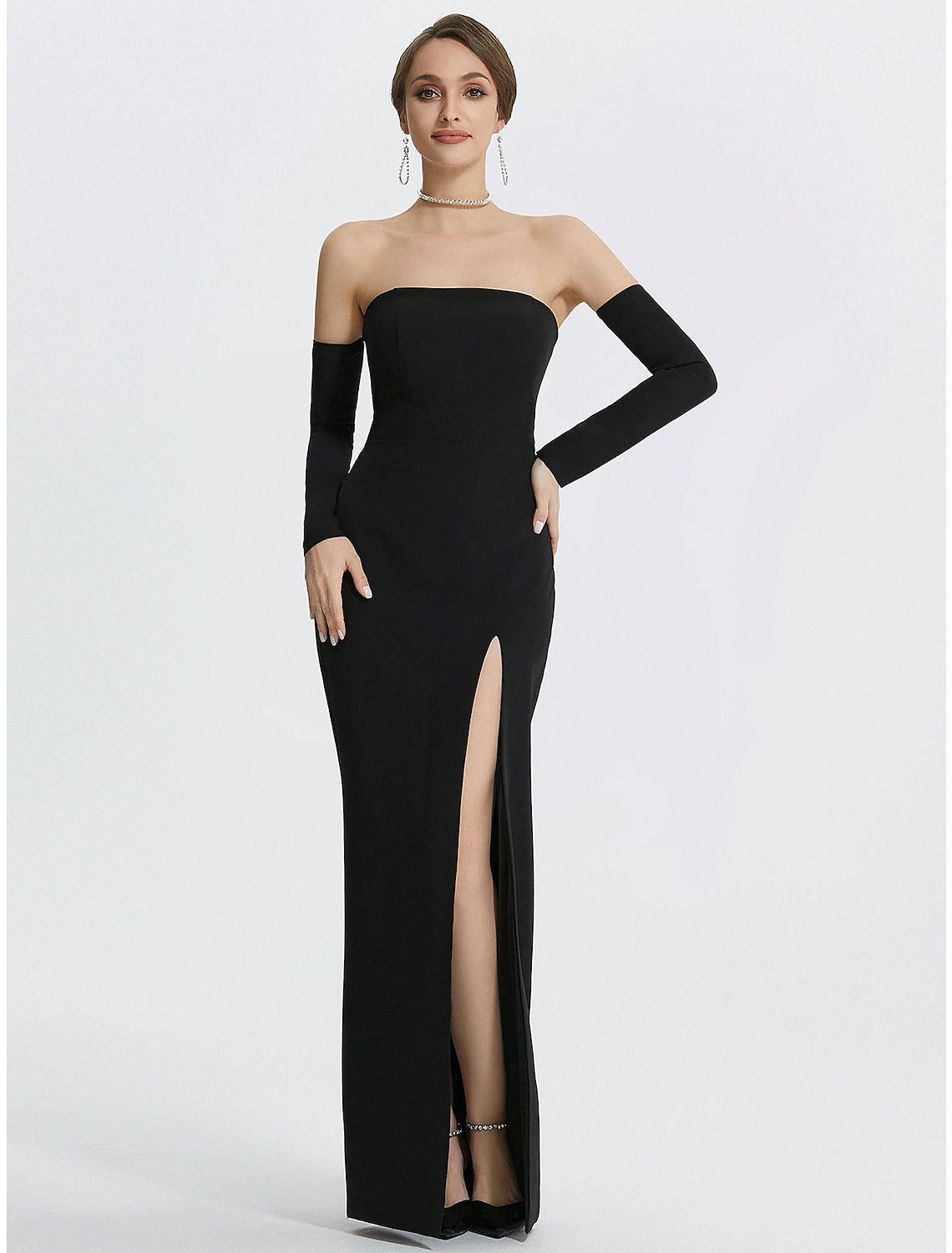 Close-up of the strapless bodice and long gloves of the black gown.