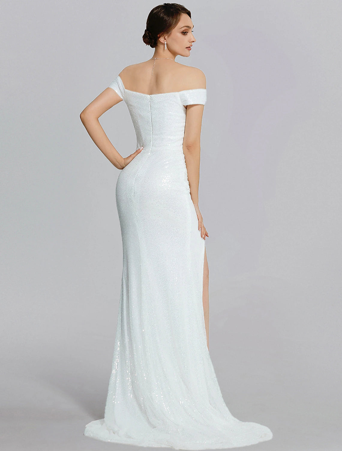 Side view of the black sequined mermaid gown, highlighting the trumpet silhouette and short sleeves.