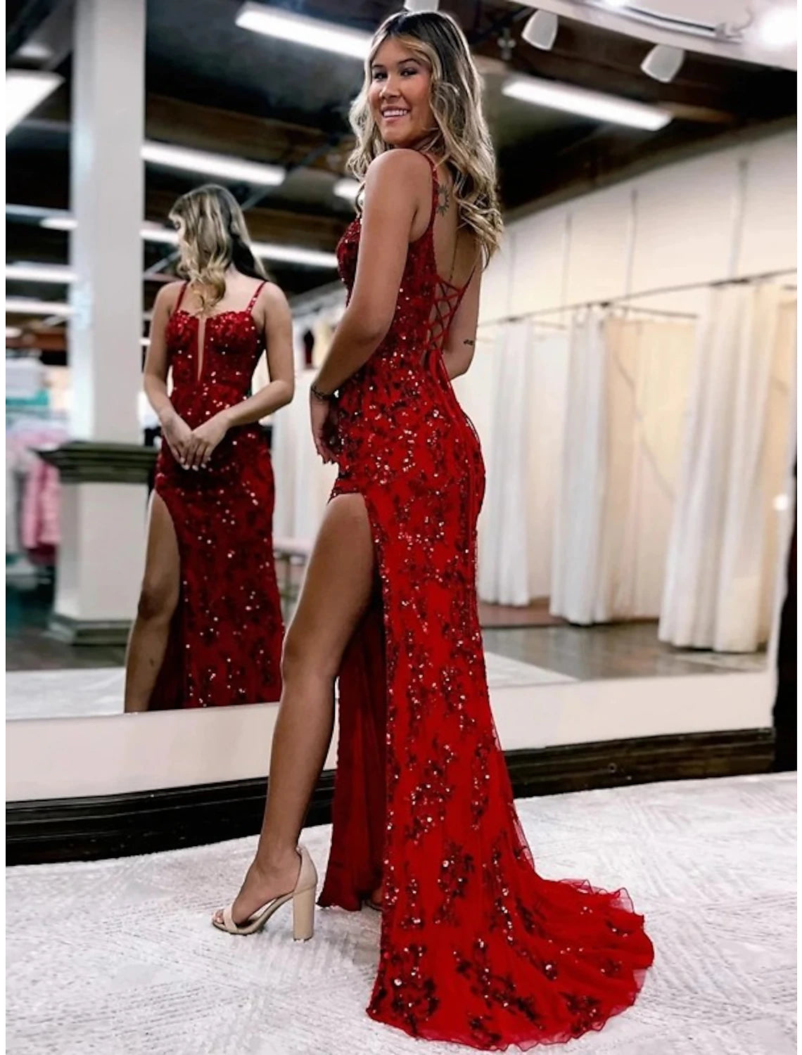 Back view of the mermaid trumpet evening gown showcasing the sweep train.