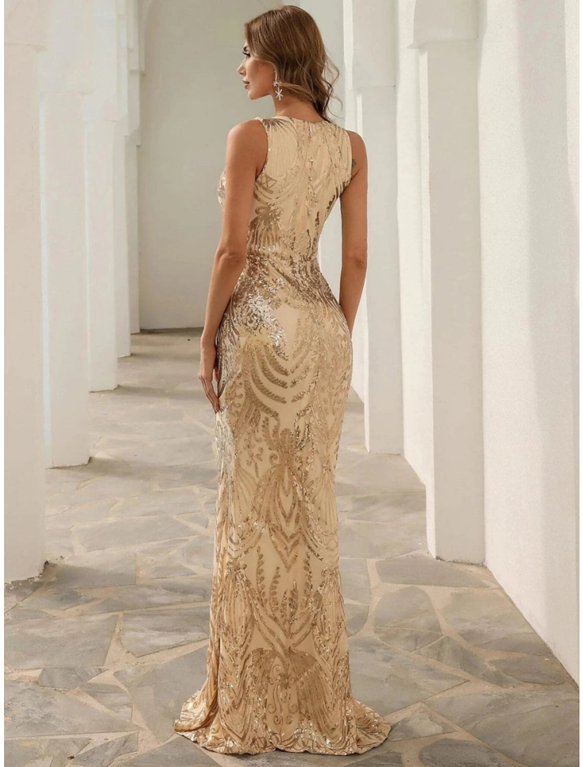 Back view of the elegant V-neck mermaid trumpet gown with a sweep train.