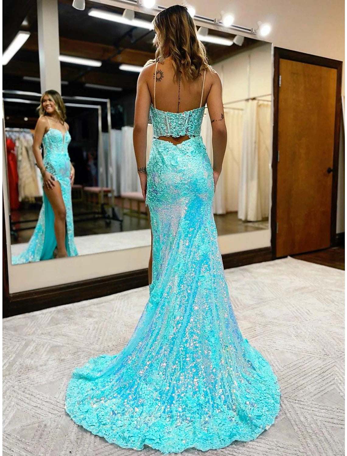 Back view of sequined mermaid trumpet gown with court train.