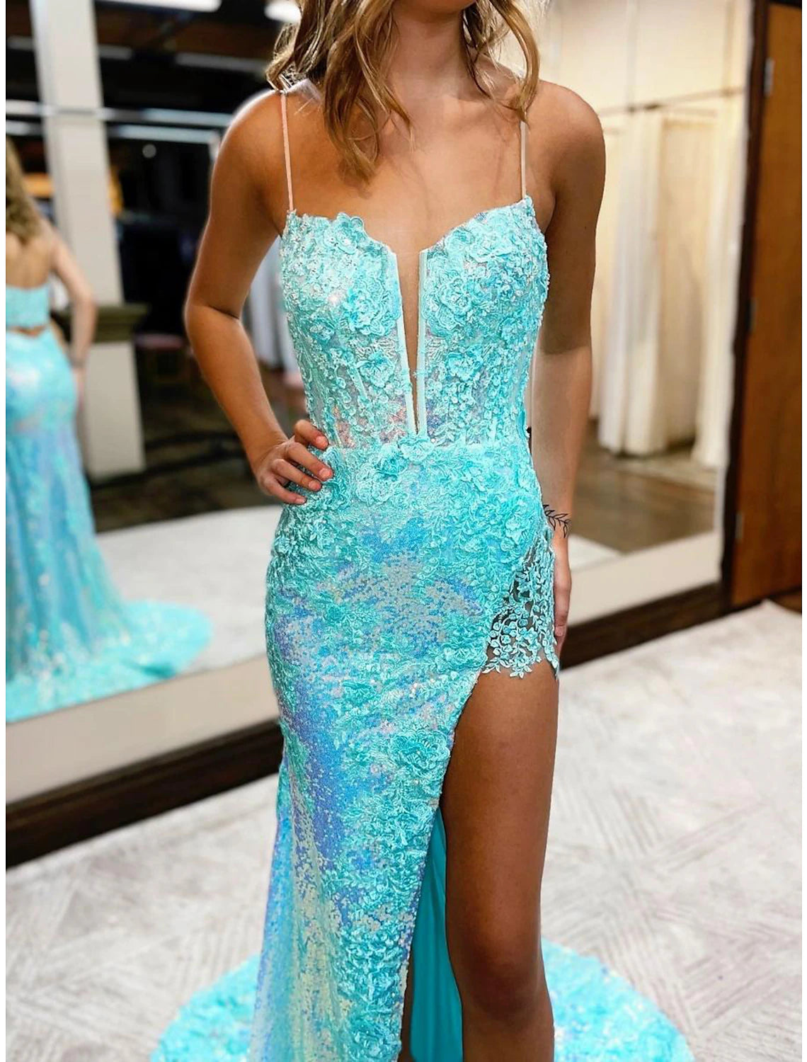Side profile of a woman wearing a sequined formal dress.