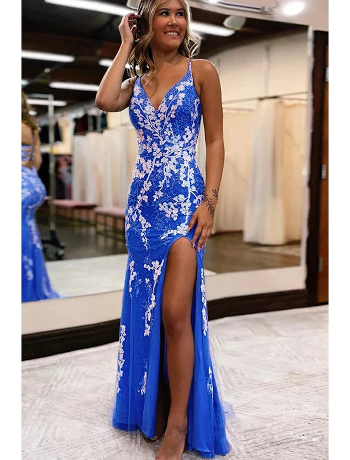 Model wearing elegant Weitese Mermaid Trumpet Prom Dress with V-neck and front slit.