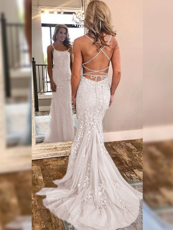 Side view of the off-shoulder trumpet mermaid gown.