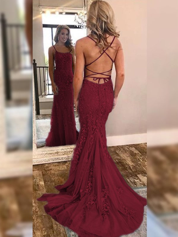 Detail of the off-shoulder neckline and lace bodice of the gown.