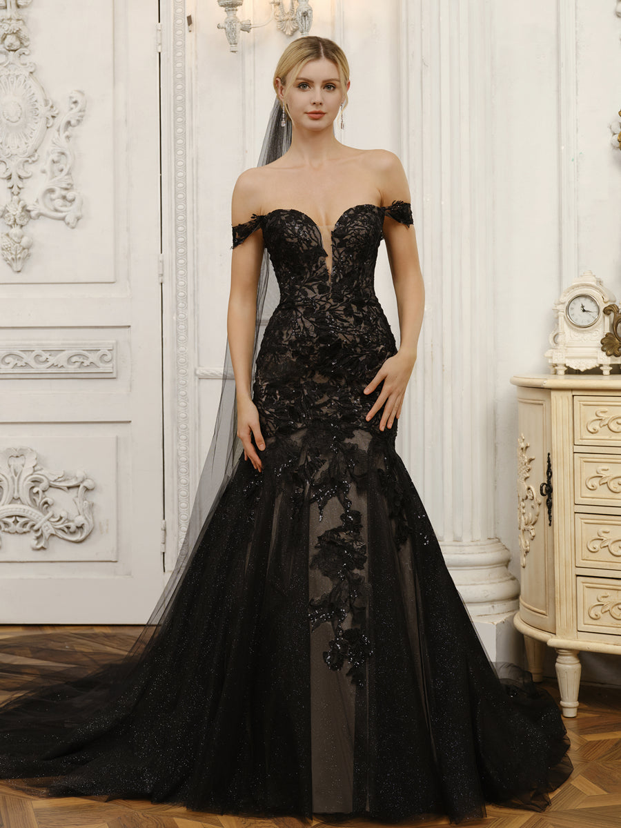 Bride wearing an elegant off-shoulder tulle mermaid wedding dress with appliques.