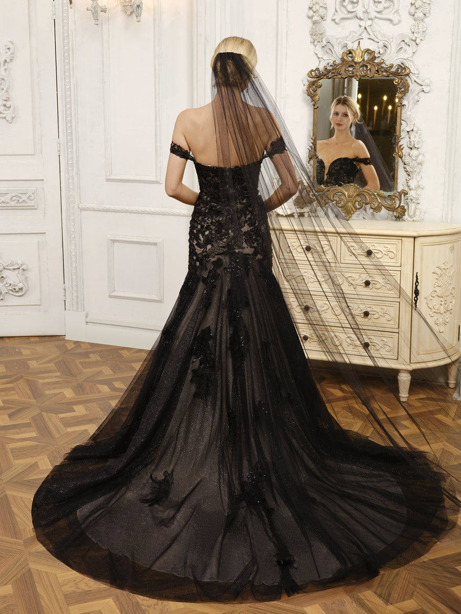 Back view of the off-shoulder tulle mermaid wedding dress with intricate appliques.