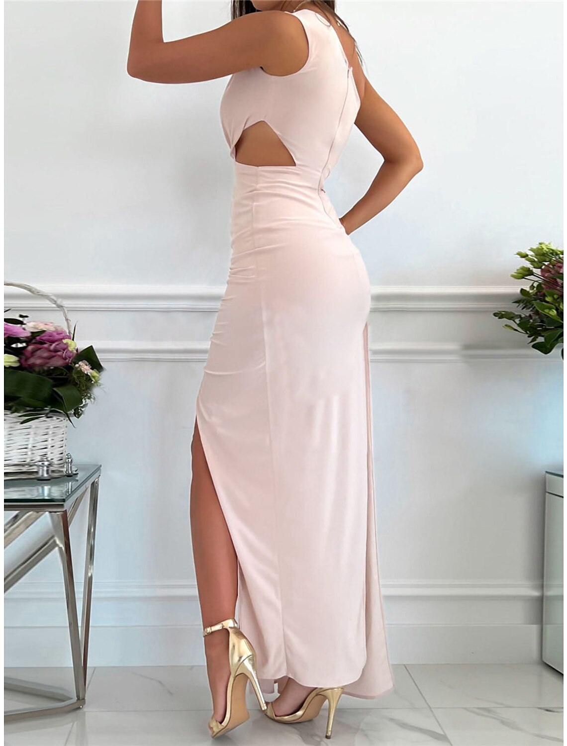 Woman wearing a red Weitese one-shoulder backless maxi dress.