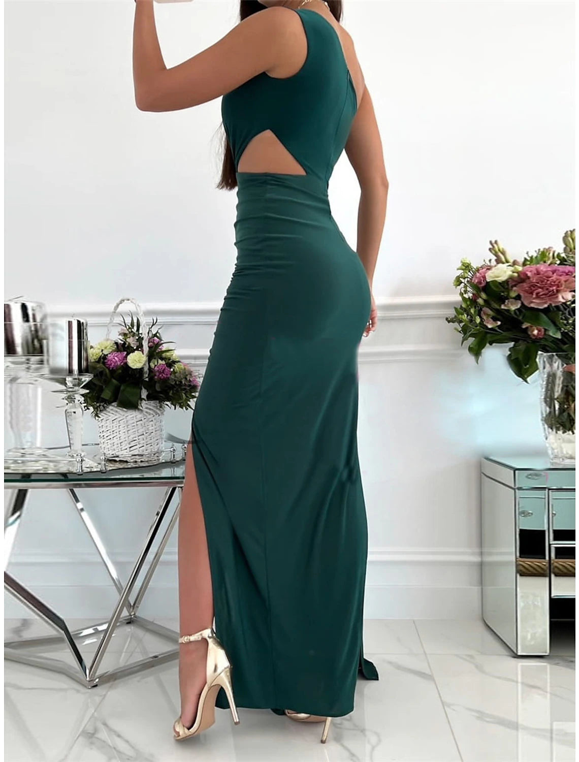 Side view of a woman in a pink Weitese one-shoulder backless maxi dress.