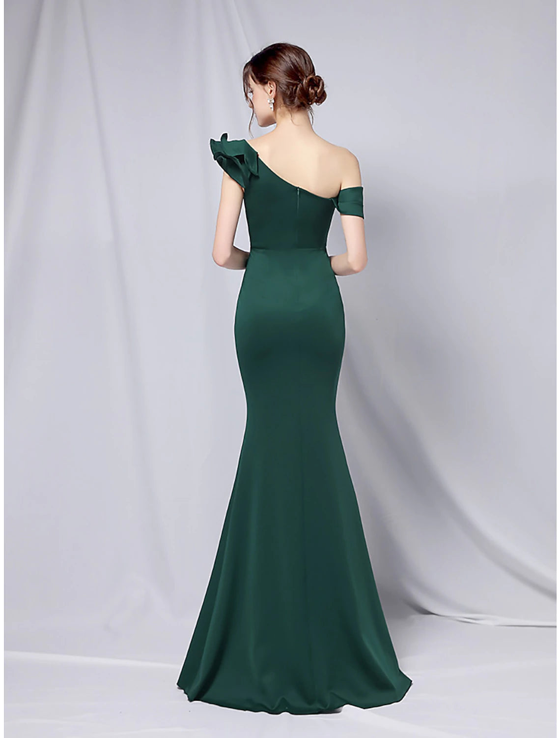 Close-up of the stretch satin fabric and ruffled detail on the Weitese evening gown.