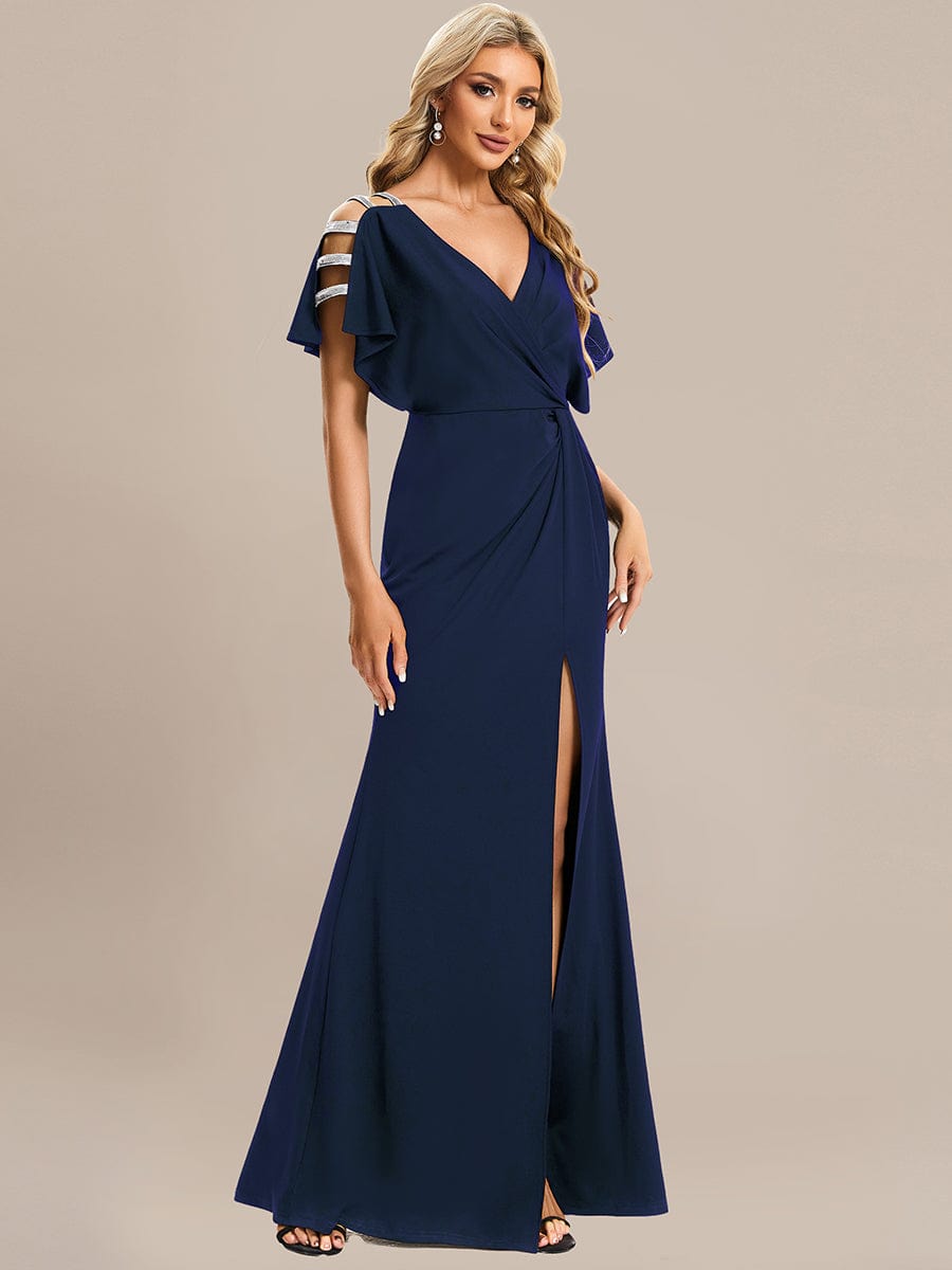Weitese navy blue pleated V-neck formal evening dress with sequin sleeves and high slit.