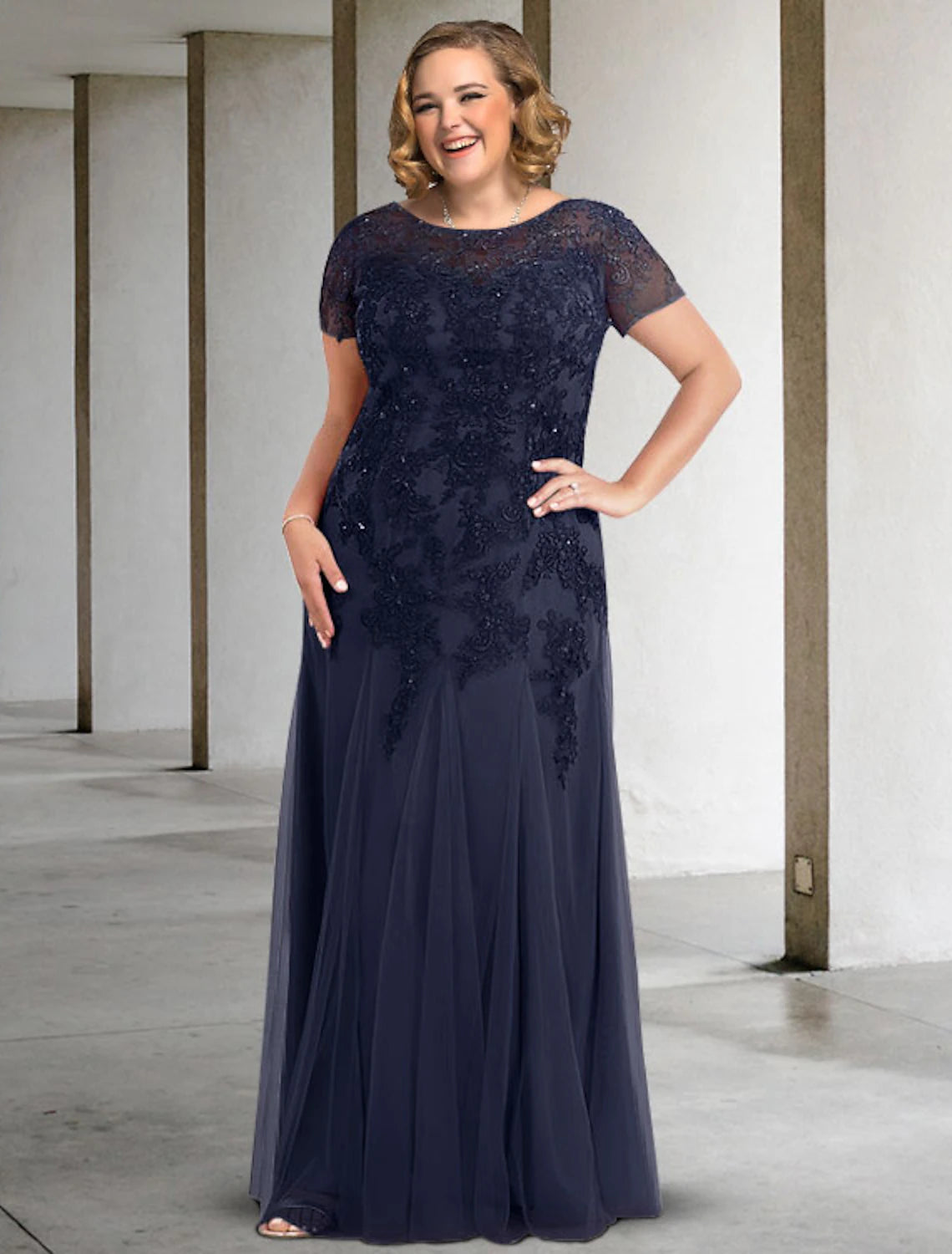 Elegant plus size A-line Mother of the Bride dress with jewel neck and short sleeves.