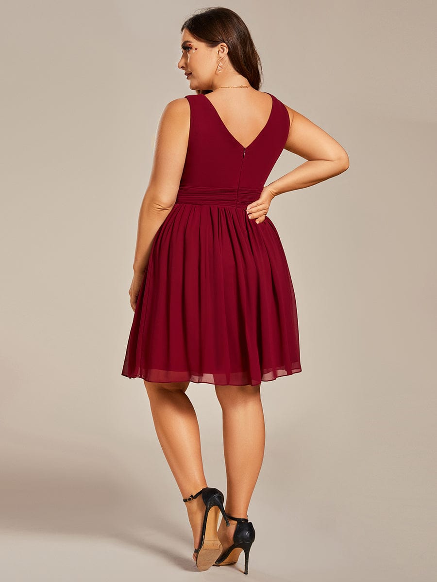 Side view of a plus size blue chiffon bridesmaid dress.