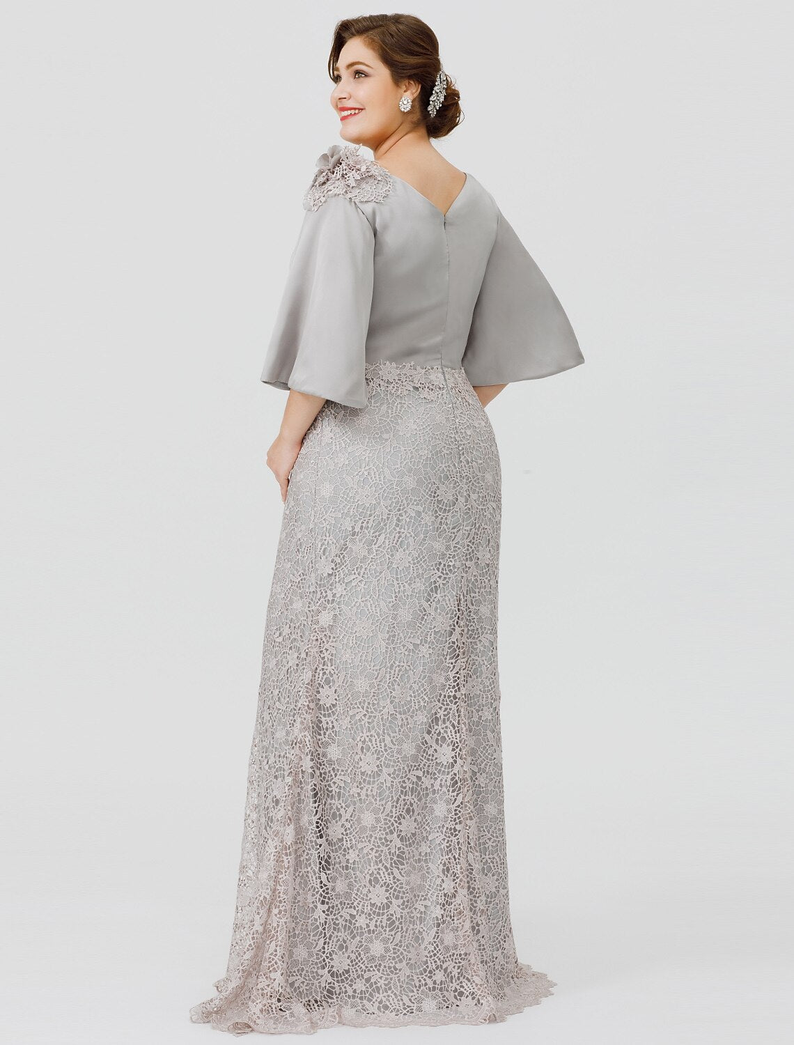 Side view of the elegant plus size mermaid dress, highlighting the sweep train and appliques.