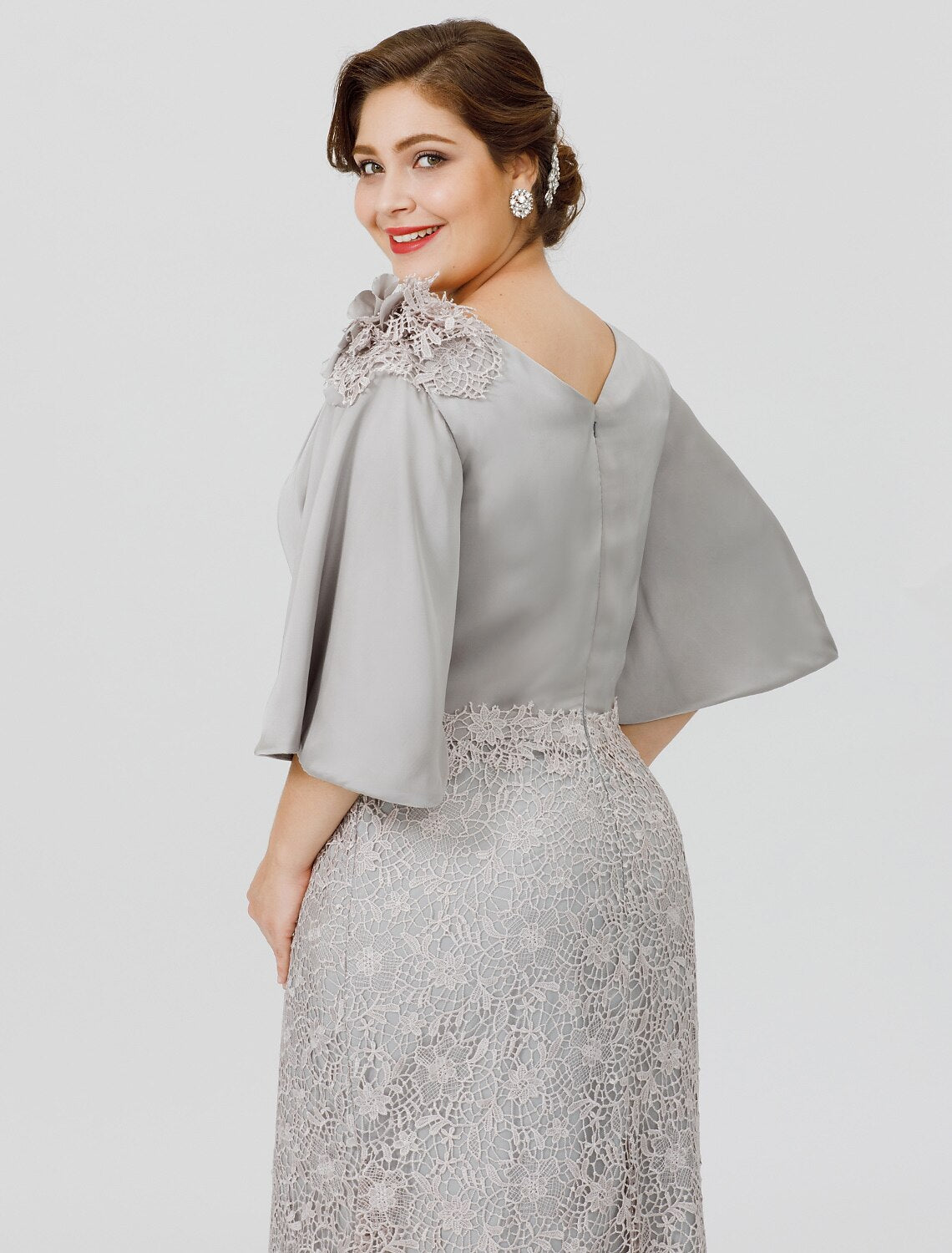 Close-up of the cowl neck and half sleeve detail on the mother of the bride dress.