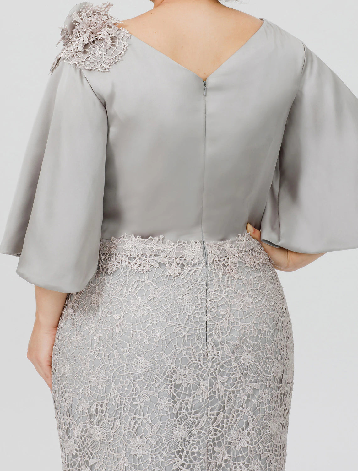 Another full length view of the woman in the elegant plus size mother of the bride dress.