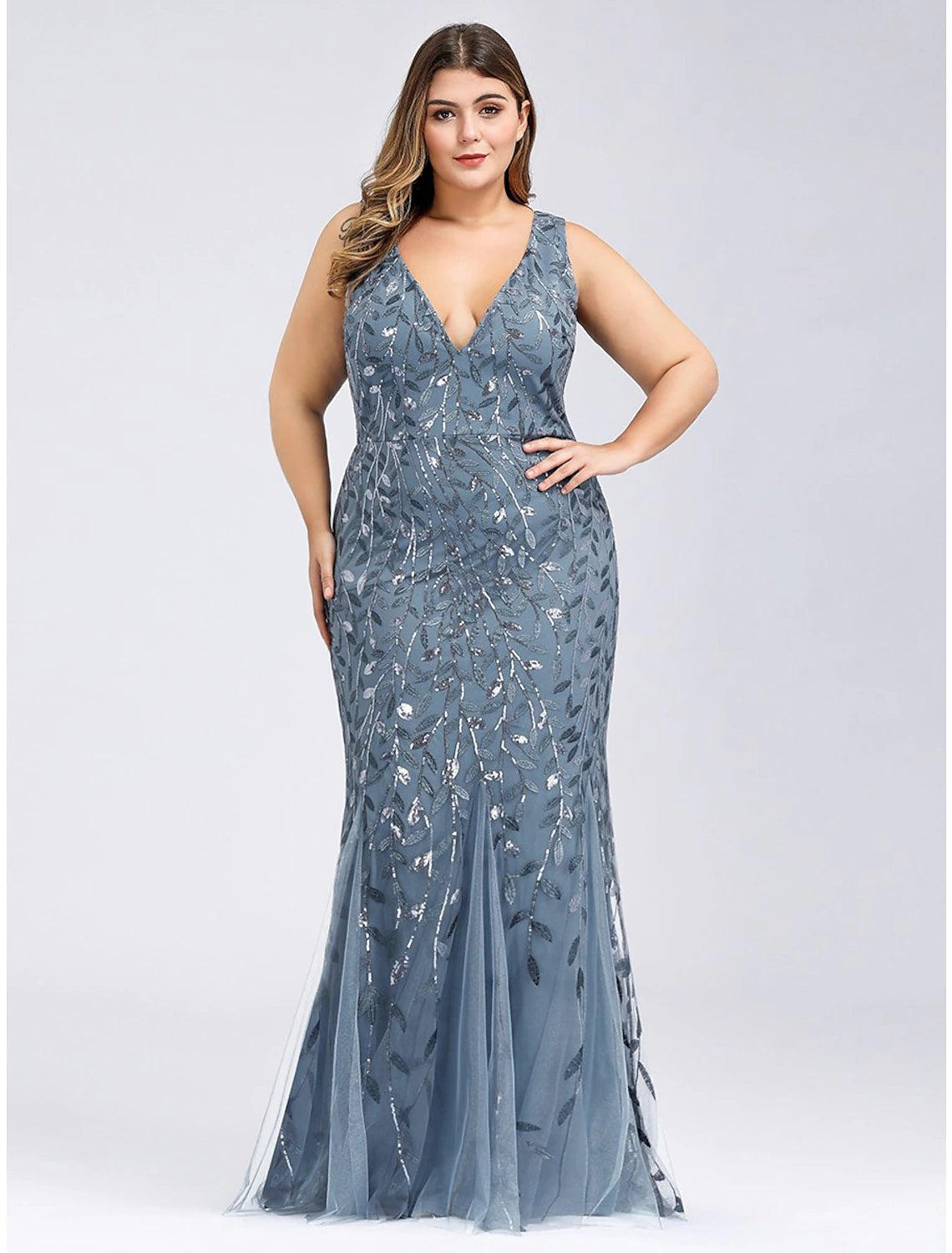 Back view of a plus size trumpet dress with delicate appliques.