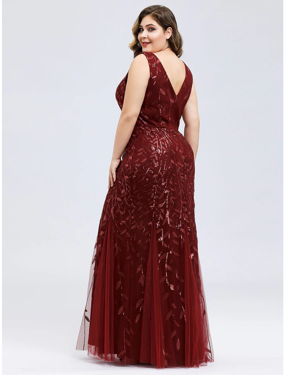 Close-up of the applique details on a plus size formal dress.