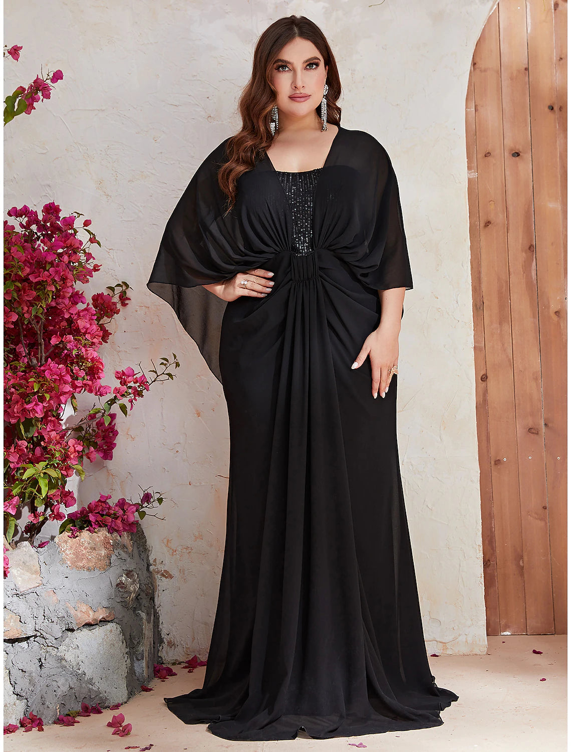Elegant plus size mermaid trumpet gown with V-neck and long sleeves, front view.