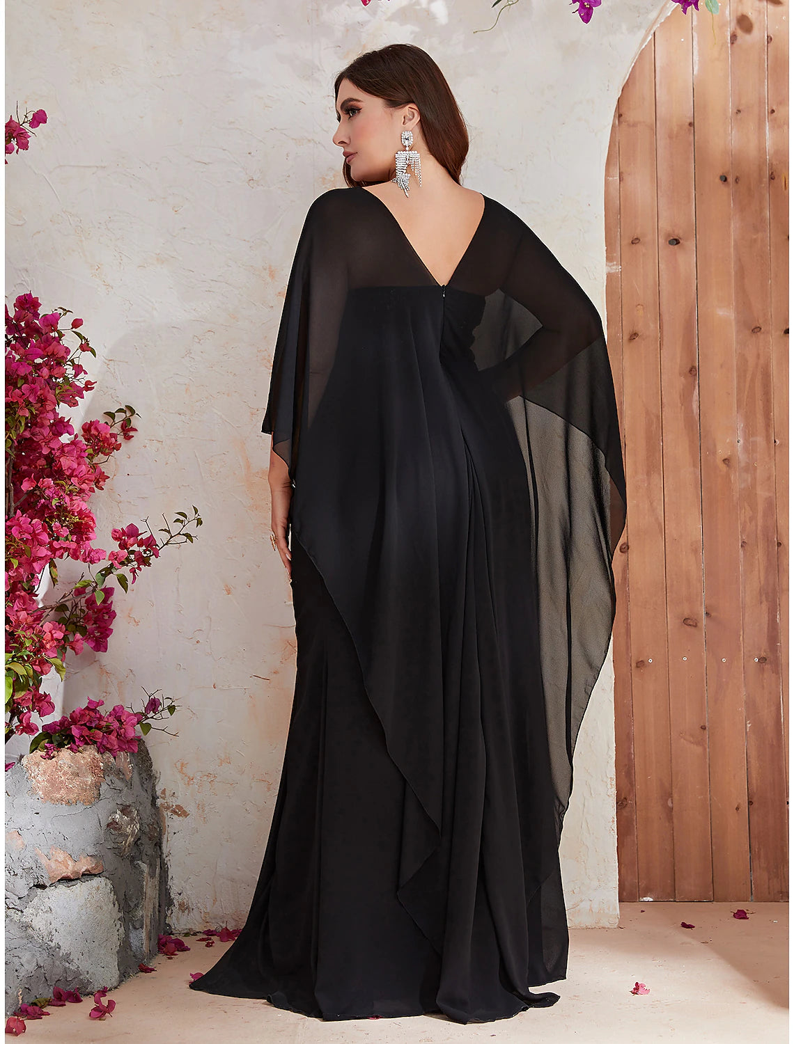 Side view of the plus size mermaid trumpet gown, showcasing the sweep train.