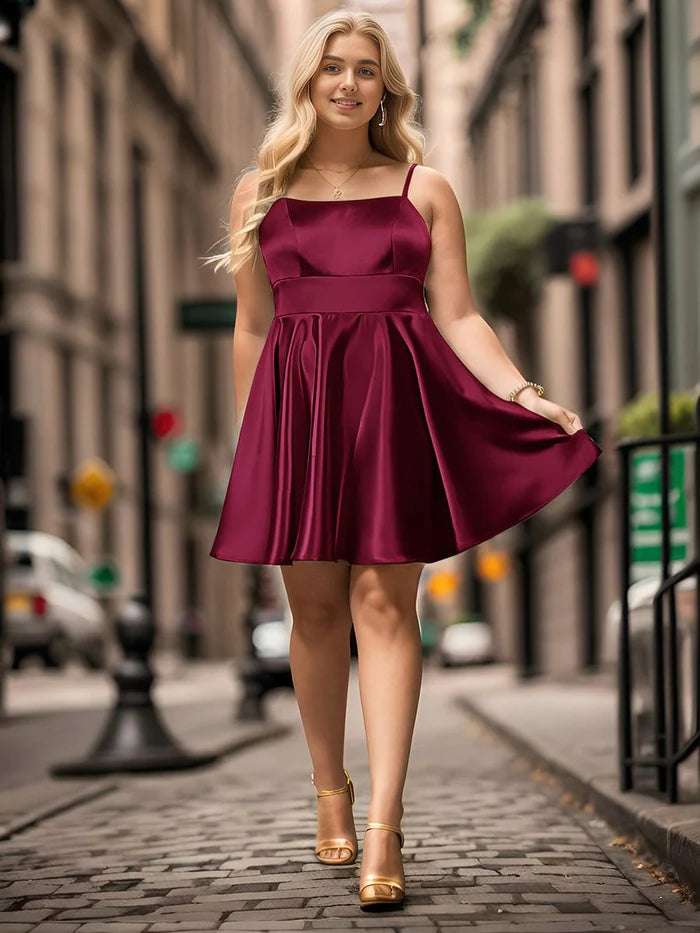Detail of the backless design and A-line skirt of the dress.