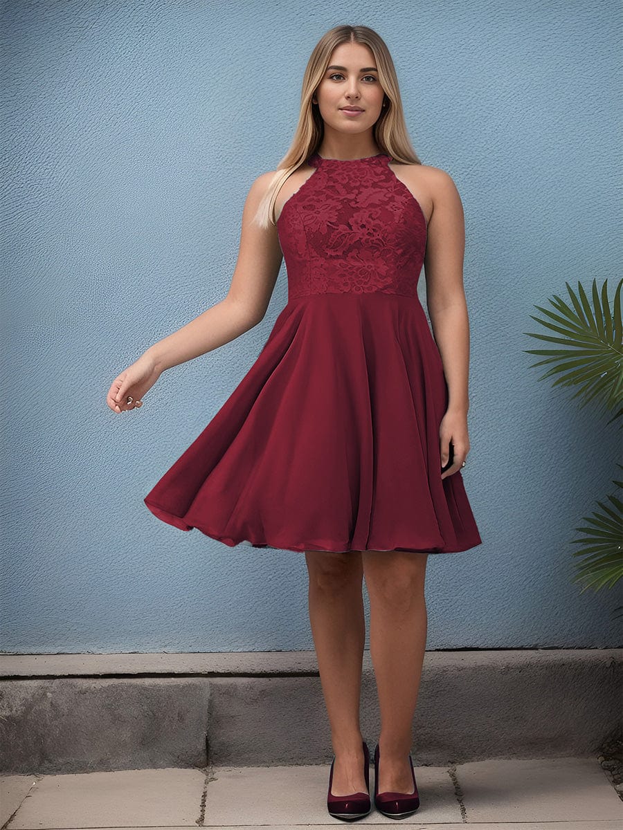 Model wearing a burgundy short lace halter neck backless chiffon homecoming dress.