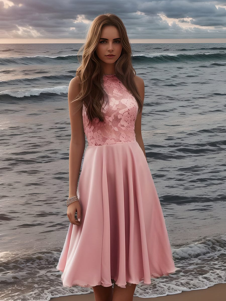 Model wearing a pink short lace halter neck backless chiffon homecoming dress.