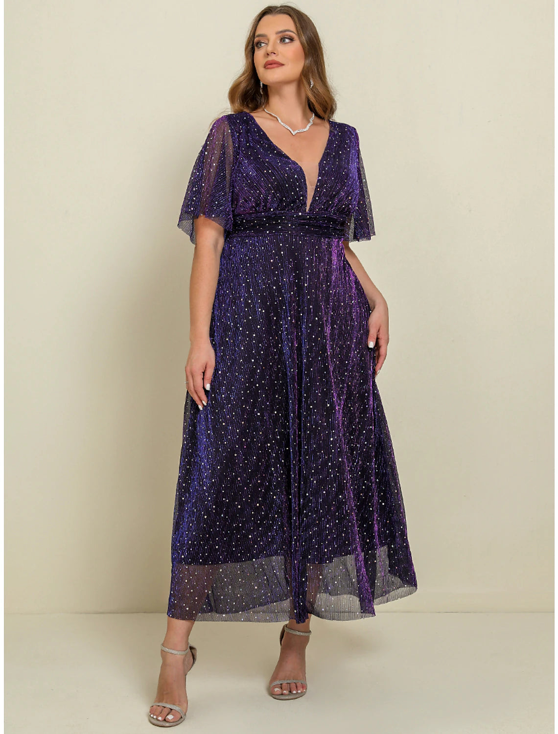 Close-up of the V-neckline and short sleeves of the purple maxi dress.