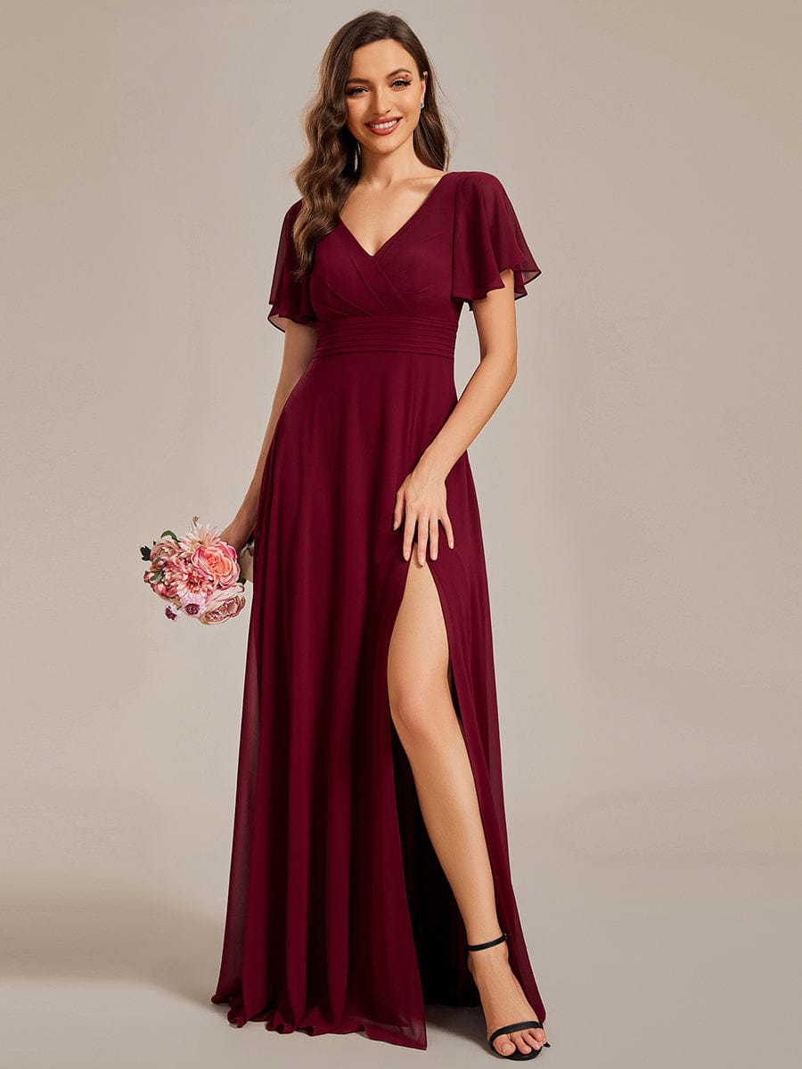 Close-up of the swing collar and ruffle sleeves on the red evening dress.