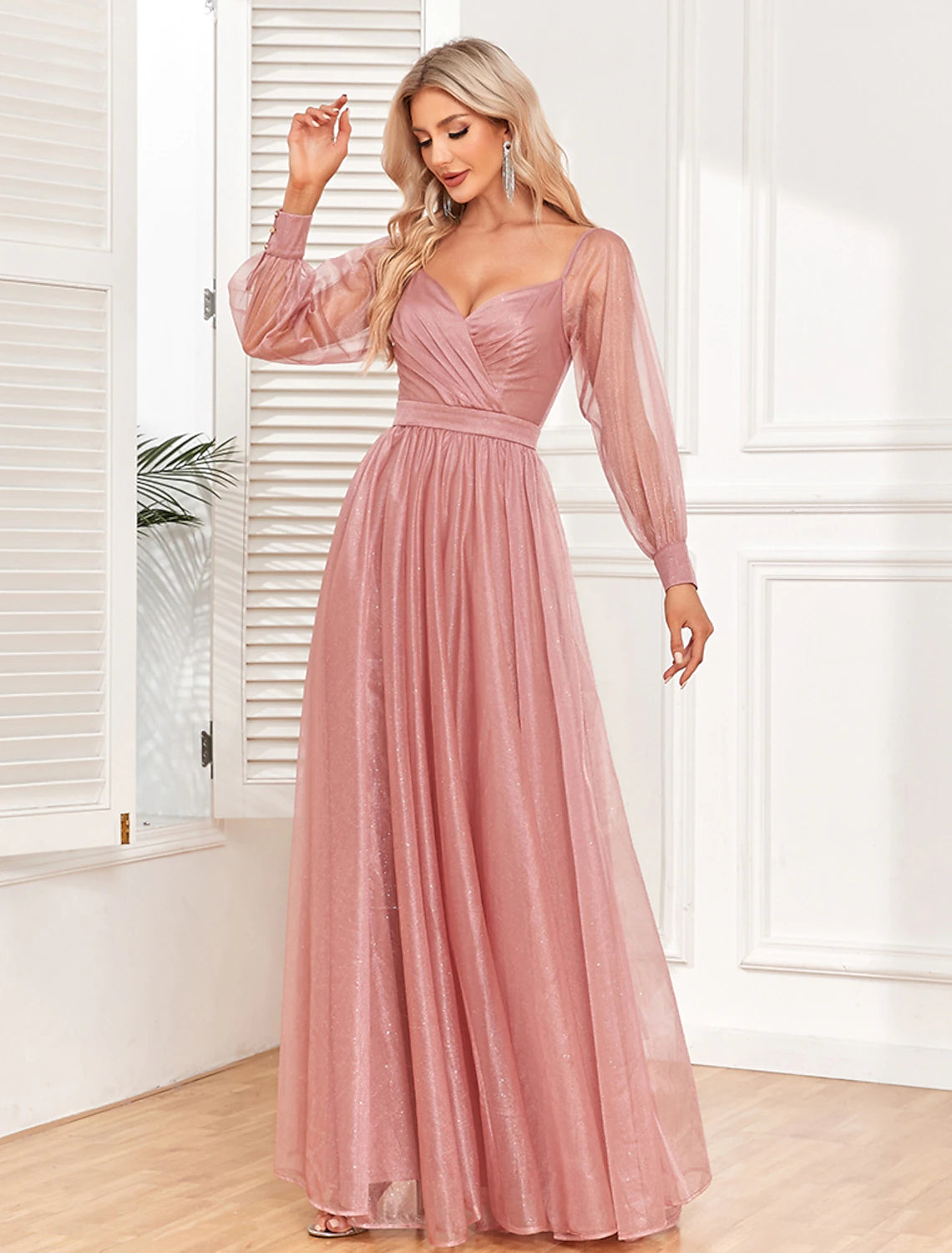 Back view of the elegant light red long sleeve dress.
