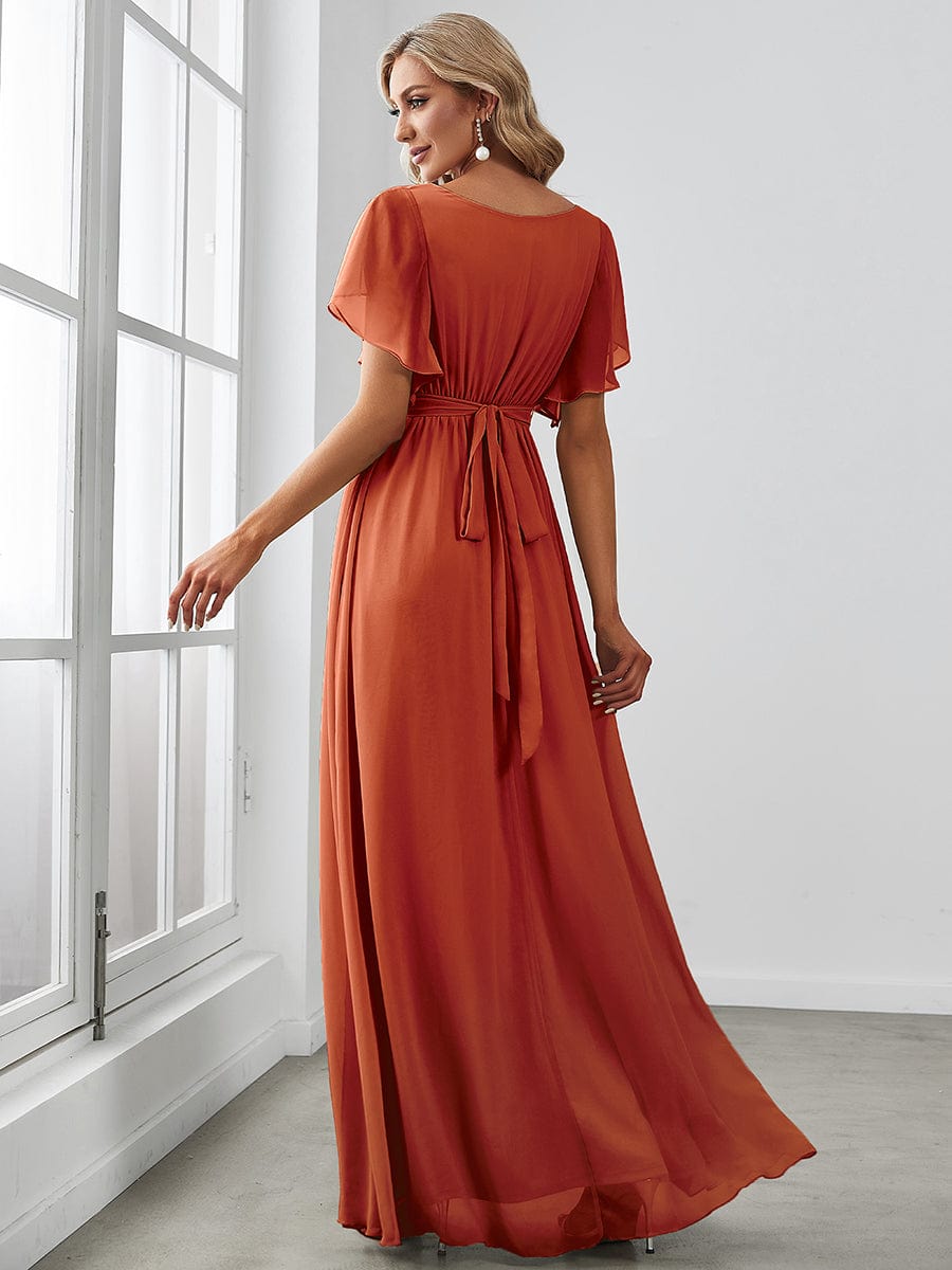Red Weitese chiffon dress with tie-waist detail.
