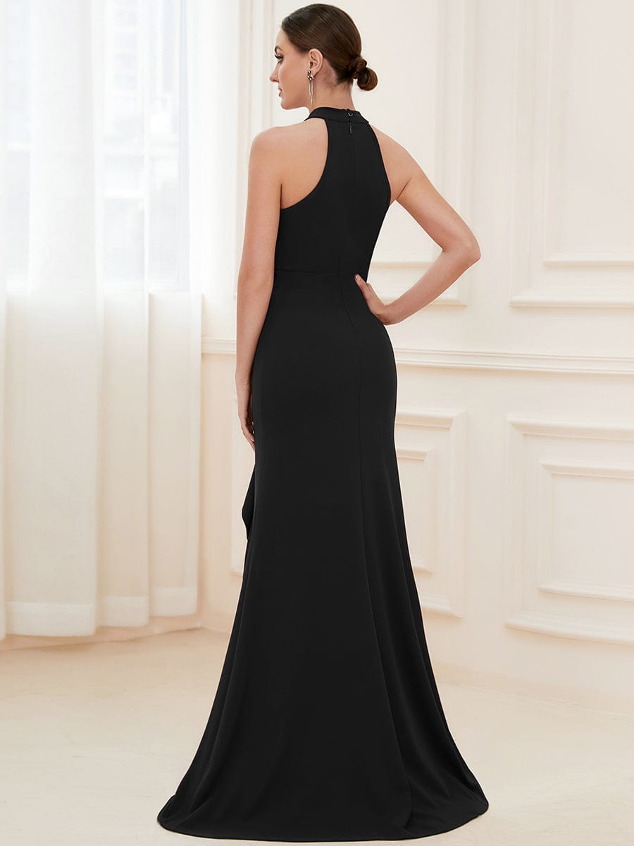Side view of black ruffled halter neck evening dress.