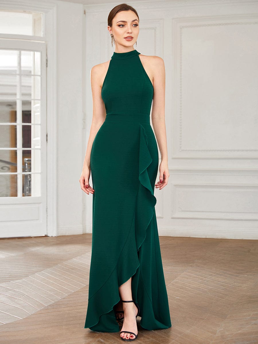 Dark green ruffled halter neck evening dress with front slit.