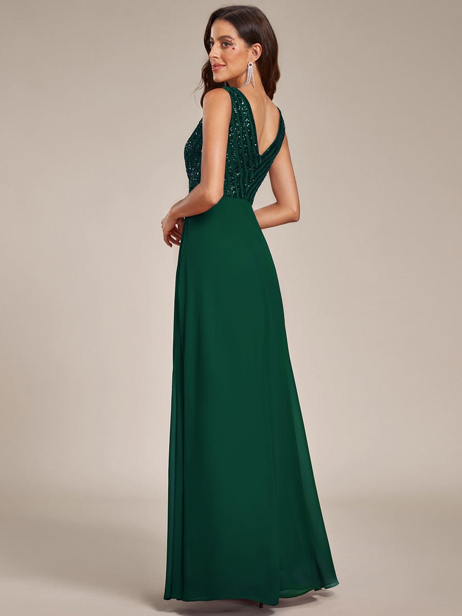 Back view of a dark green sequin double V-neck formal evening dress.