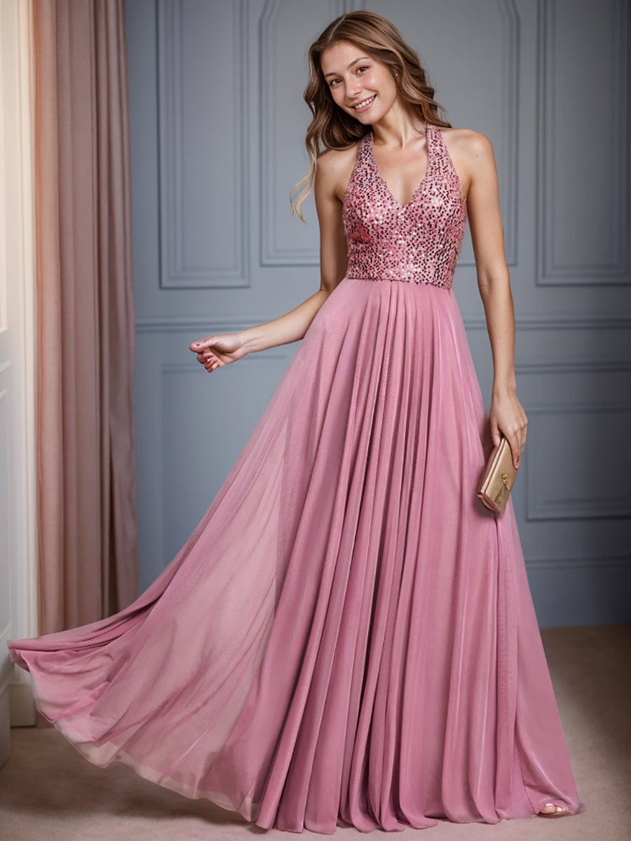 Close-up of the sequin halter neckline and bodice of the red dress.