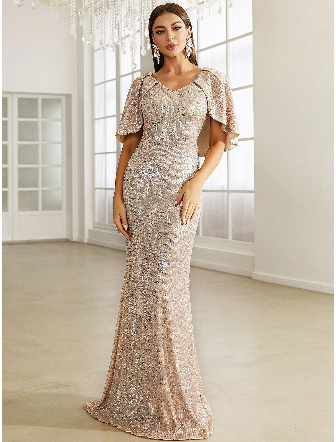 Weitese sequined mermaid evening gown with V-neck and half sleeves.