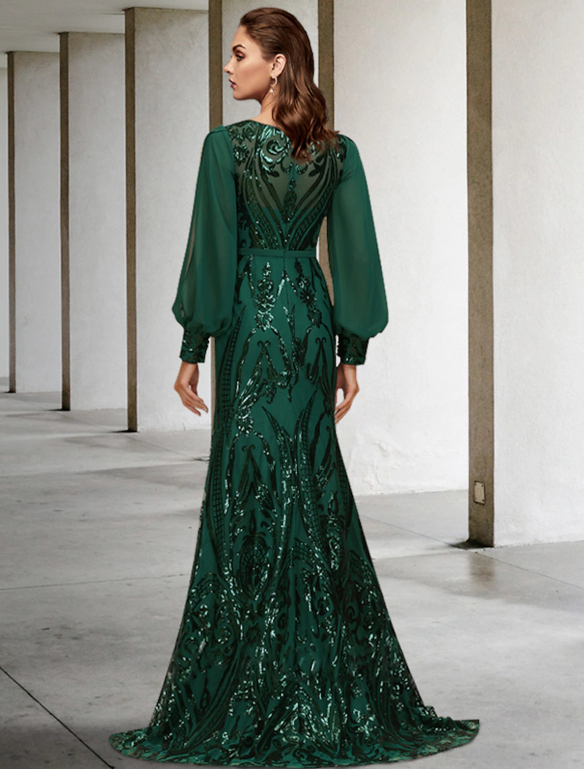 Side view of the mermaid gown, highlighting the sweep train and sequin details.