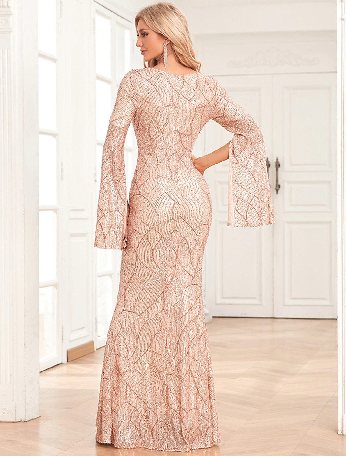 Side view of the elegant sequined mermaid evening gown.